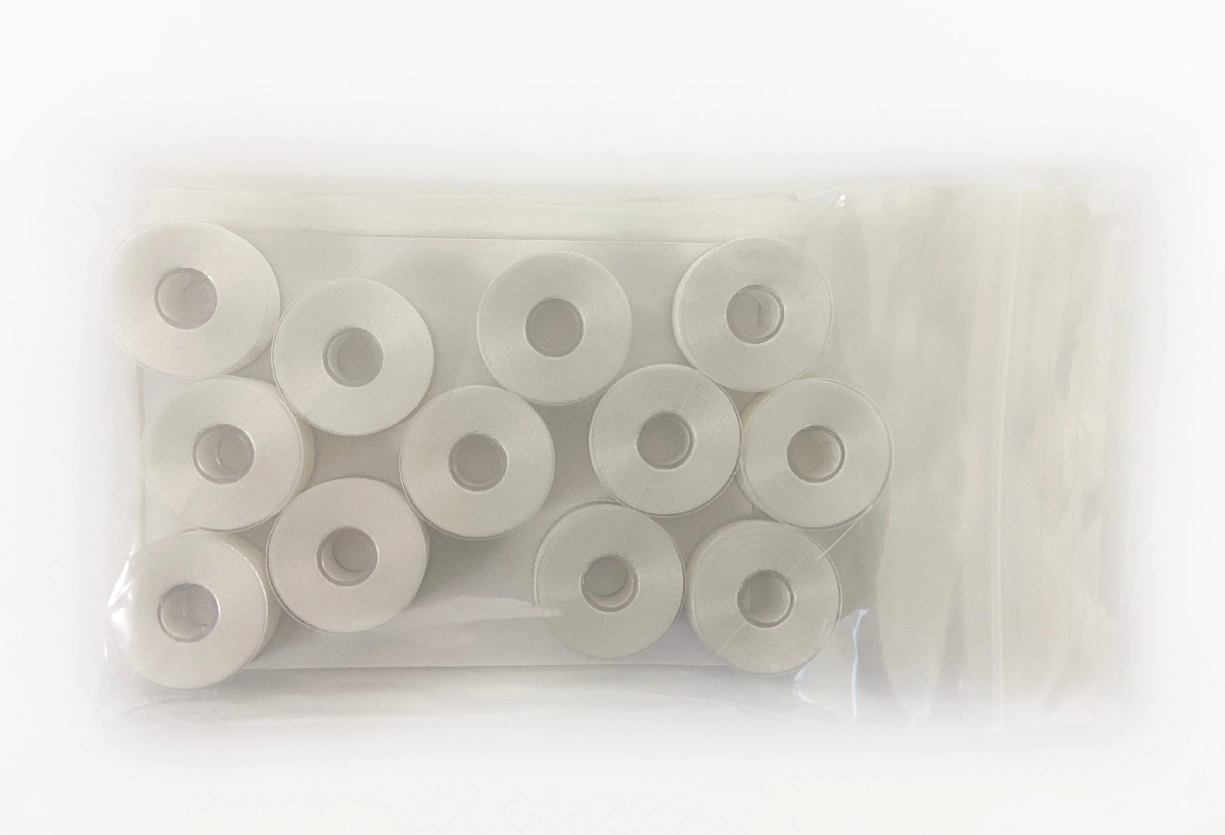 12 Bobbins - NEB Plastic Sided Machine Embroidery Bobbins Size L - White